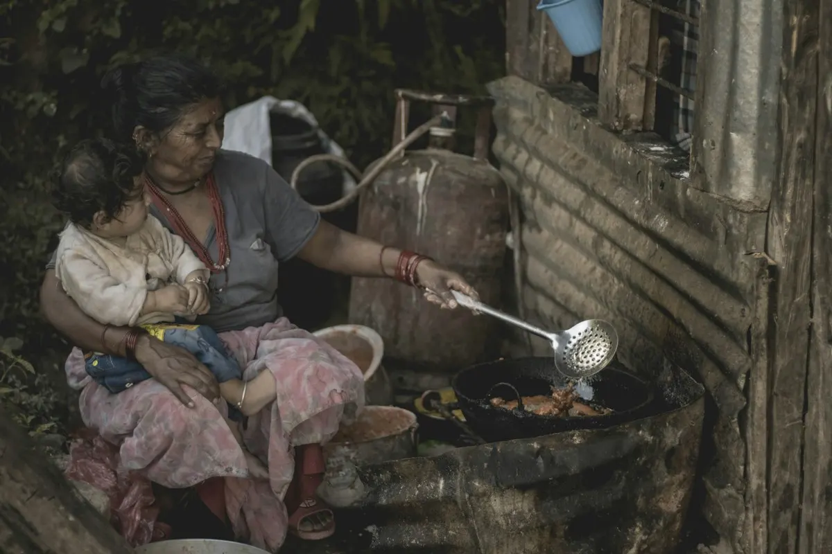 A mother cooking with her child